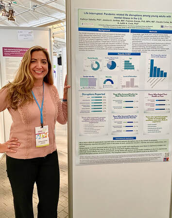 Picture of Center collaborator with research poster at a conference