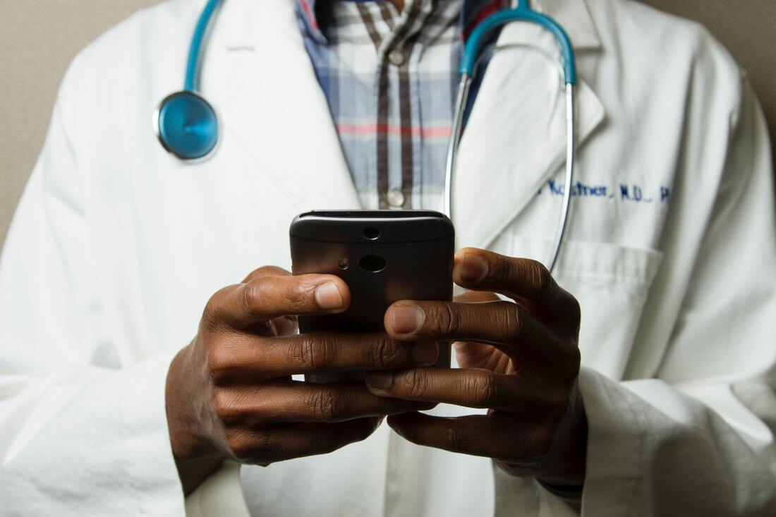 Picture of a doctor using a smart phone